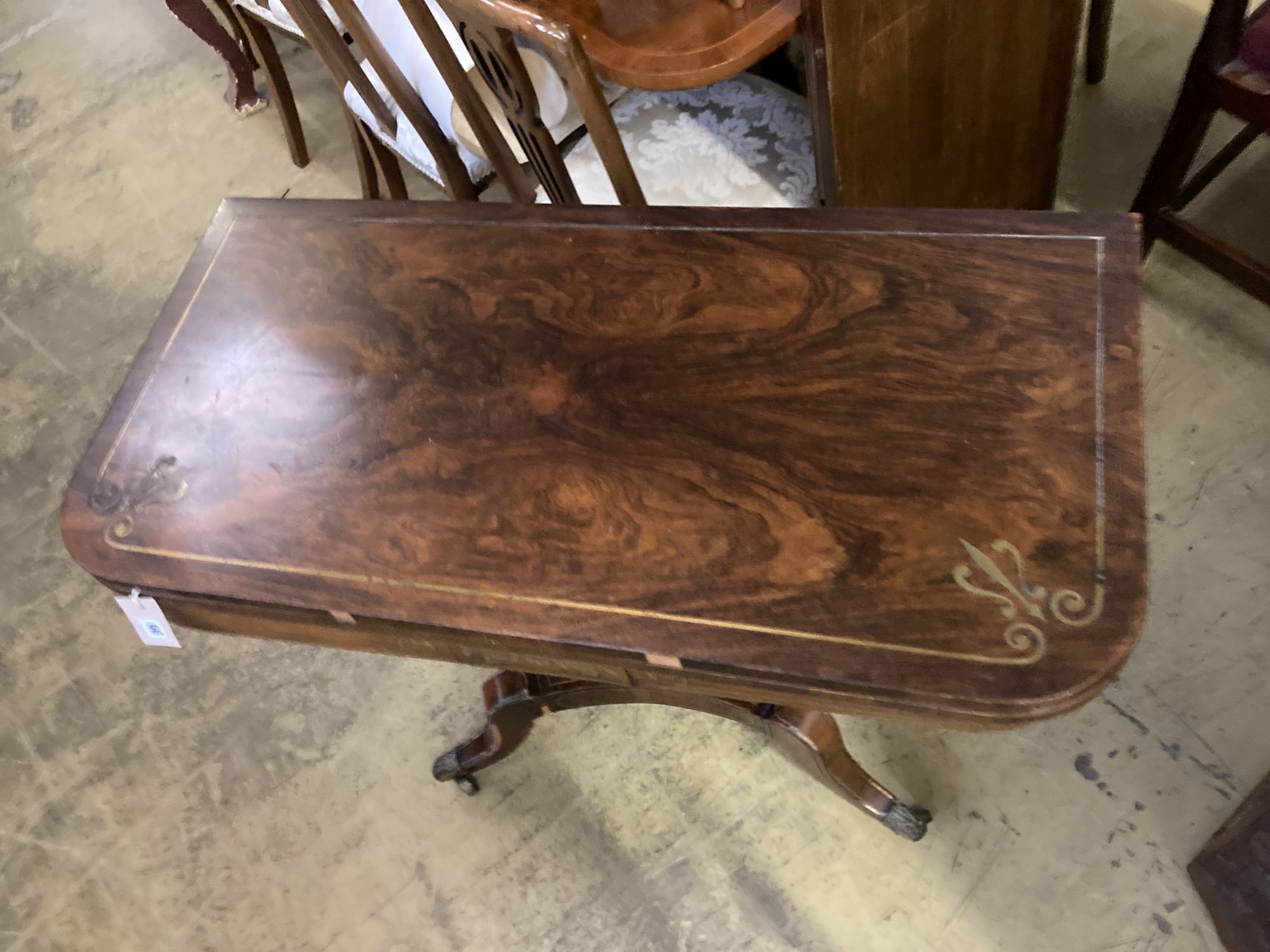 A Regency brass inlaid rosewood folding card table, width 91cm, depth 45cm, height 74cm